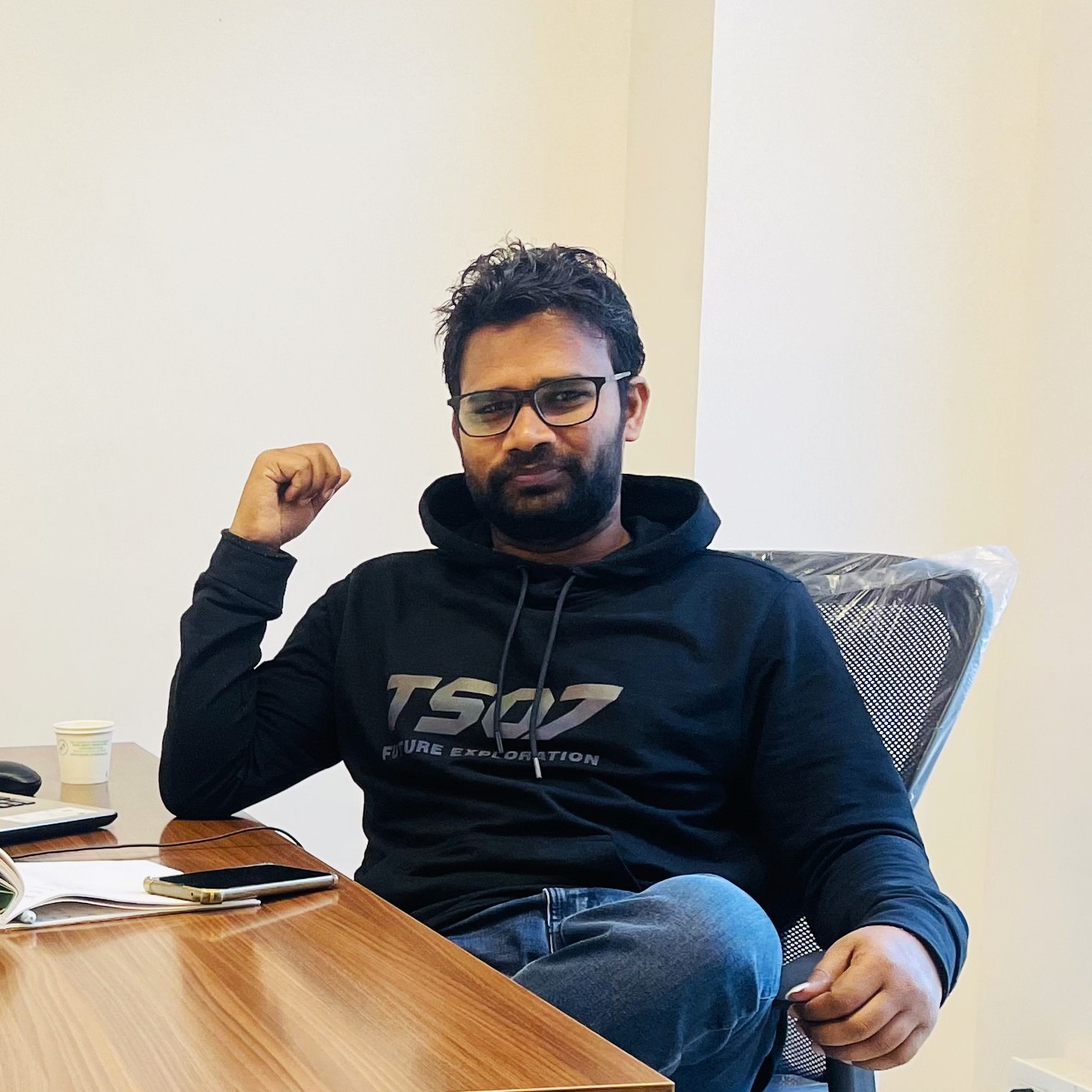 Raushan Yoganta on a chair in his office